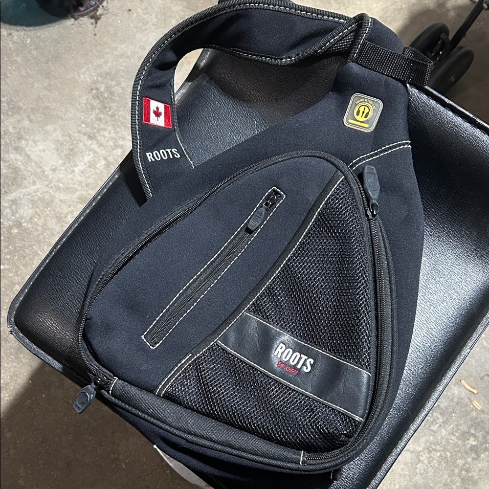 Roots Black Triangular Backpack - image 1